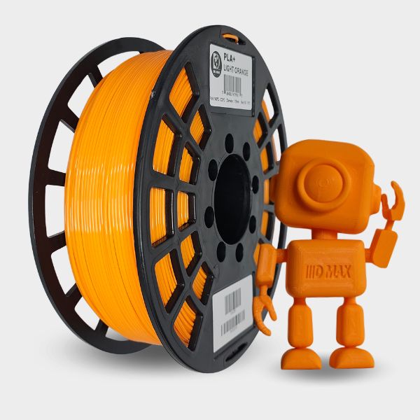 Spool of light orange filament and small orange robot toy on a light gray background