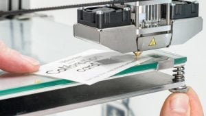Adjusting 3D printer screw to level its bed platform